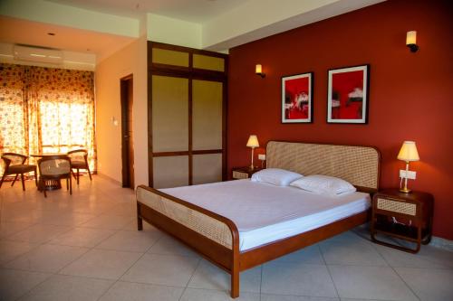 a bedroom with a bed and a dining room at The Pavilion at Riverside Park 