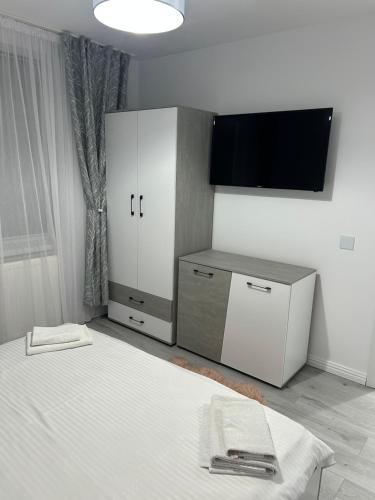 Ένα ή περισσότερα κρεβάτια σε δωμάτιο στο Fox Apartament