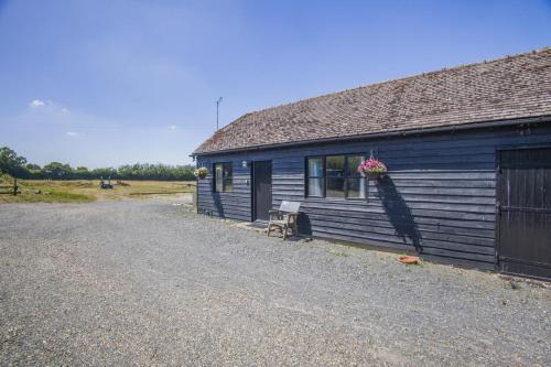 a blue building with a bench in front of it at 1 Bed in Great Sampford oc-f32654 in Great Sampford