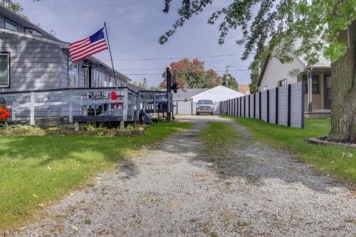 an american flag on the side of a house at Neenah Home with Deck Near Lake Winnebago in Neenah