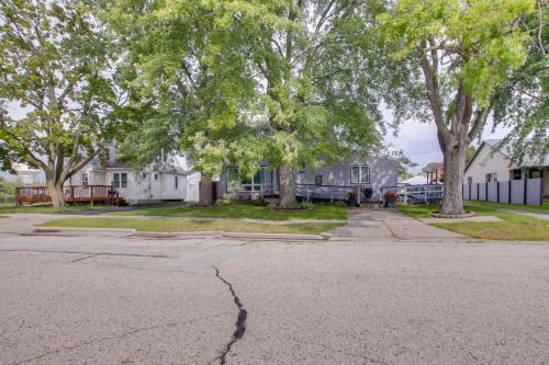 an empty street in front of a house at Neenah Home with Deck Near Lake Winnebago in Neenah
