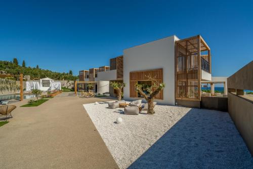 a rendering of a building with a courtyard at Zante Maris Suites - Adults Only in Tsilivi