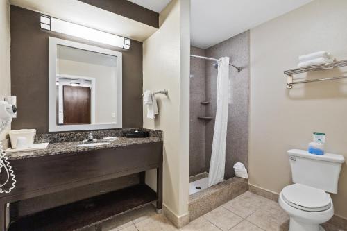 a bathroom with a toilet and a sink and a shower at Comfort Inn Santa Cruz North in Santa Cruz