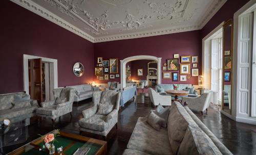 a living room filled with furniture and a ceiling at Bellinter House Hotel & Spa in Navan