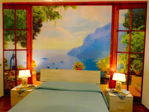 a bedroom with a bed with a painting on the wall at LUKAS HOME CON IL CUORE Appartamento 3 camere al piano terra e appartamento 1 camera in taverna in Merone
