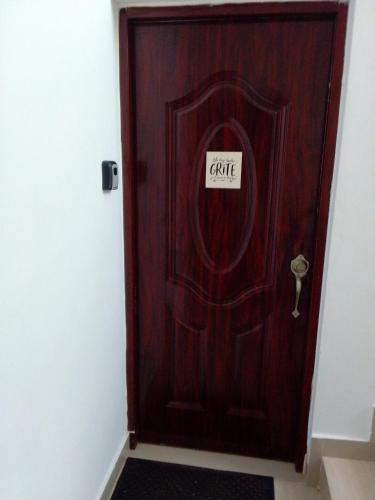 a wooden door with a sign that reads caffe at Villa del mar in Bayahibe