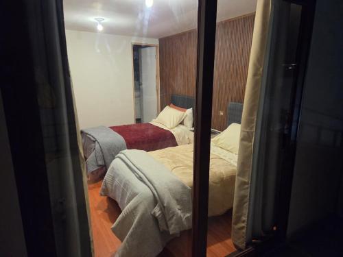 Ένα ή περισσότερα κρεβάτια σε δωμάτιο στο Casa Puente Bolognesi