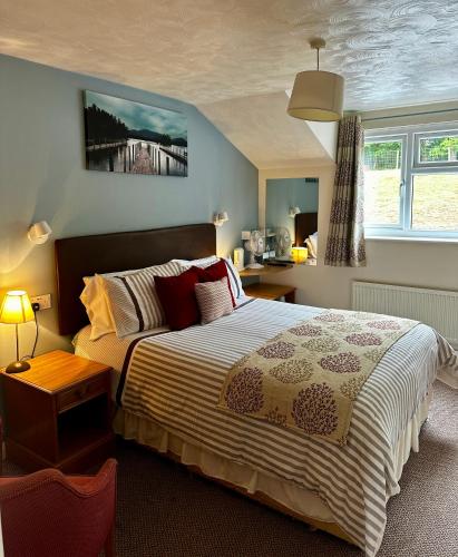 a bedroom with a large bed and a bridge at The Kings Head Inn in Gloucester