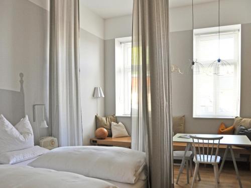 Postel nebo postele na pokoji v ubytování grätzlhotel Schönbrunn