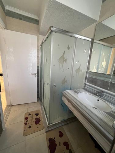 a bathroom with a shower and a sink at Evoke suites apartment in central madinaty 2 bedroom in Madinaty