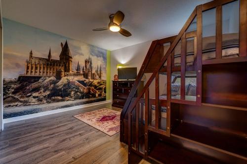 a room with a bunk bed and a mural of a building at NEW, Disney,10mi, Themed Rooms, PvtPool, Movie, Game Room in Kissimmee