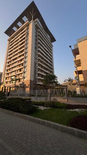 a large building in front of a building at Penta Square Executive Hotel Apartments City View DHA Lahore in Lahore