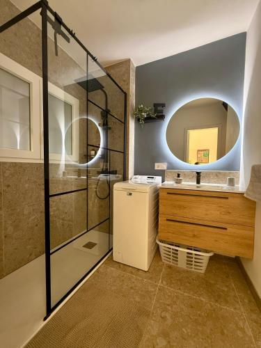 a bathroom with a sink and a mirror at El Bikini Cullera - Junto a la playa - Right on the beach in Cullera