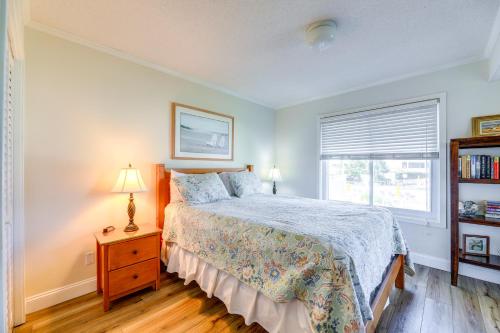 a bedroom with a bed and a window at Eclectic Atlantic Beach Condo with Amenity Access! in Atlantic Beach