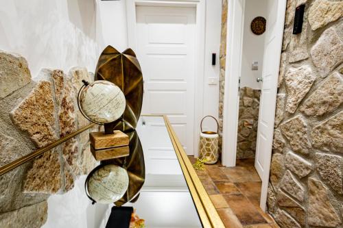 a staircase in a home with a stone wall at Dimora Milù in Foggia