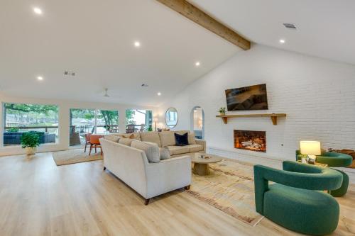 a living room with a couch and a fireplace at Private Dock Lakefront Enchanted Oaks Retreat in Enchanted Oaks