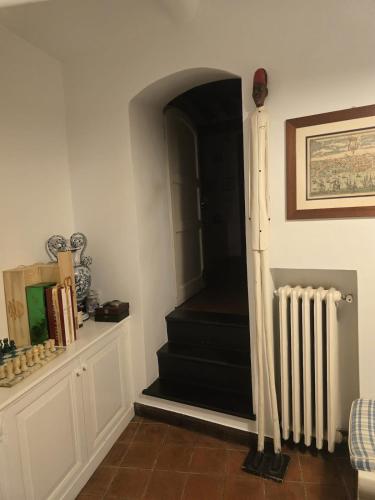 a hallway with a stairway with a stair case at Il nido sul mare blu in Bogliasco