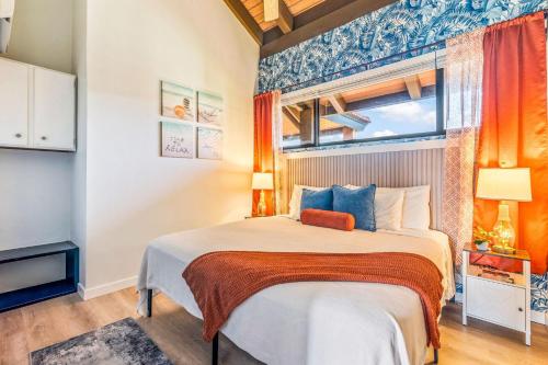 a bedroom with a large bed and a window at Perch - Luana Kai Loft C308 in Kihei