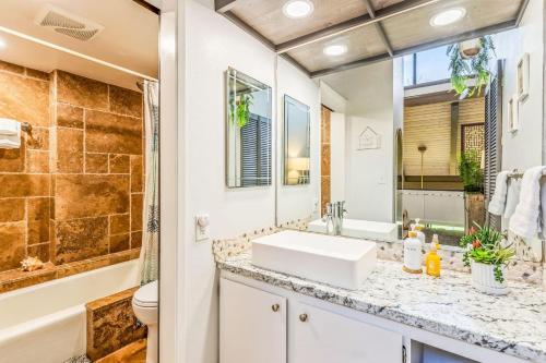 a bathroom with a sink and a shower at Perch - Luana Kai Loft C308 in Kihei