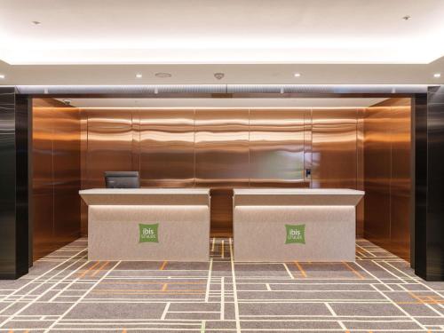 an office with a desk with a laptop on it at ibis Styles Ambassador Jeonju City Centre in Jeonju
