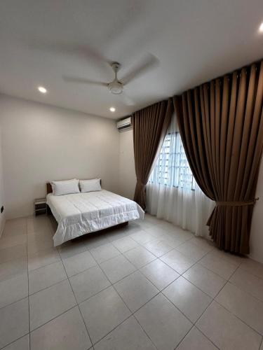 Postel nebo postele na pokoji v ubytování Teratak MakTeh