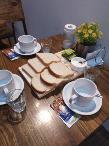 a table with a bunch of slices of bread on it at Hotel Gutierrez in Mendoza