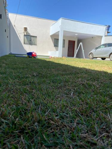 a house with a grassy yard in front of a house at Smart Home in Sinop - Completo in Sinop