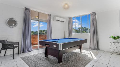 a living room with a pool table in it at Two Storey Gem In Heart Of Woorim in Woorim