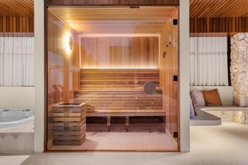 a bathroom with a shower with a tub at Your Own Luxury Coastal Beachfront Wellness Retreat 14 sleeps in Casuarina