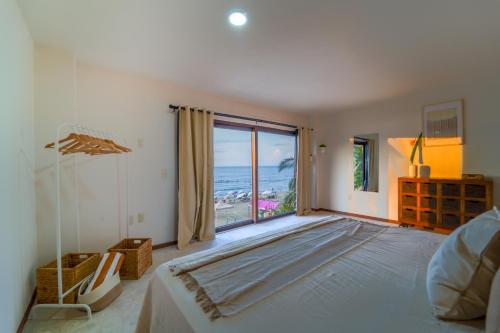Postel nebo postele na pokoji v ubytování Maramara Playa