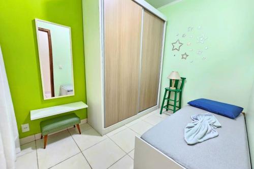 Кровать или кровати в номере Maiochi Beach House - Quadra Mar - 200m Praia