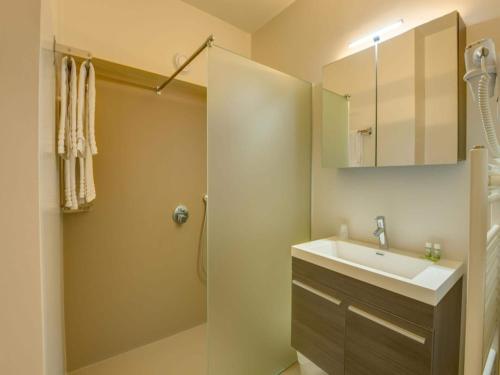 a bathroom with a sink and a shower at Standard Duplex Apartment in Antwerp in Antwerp