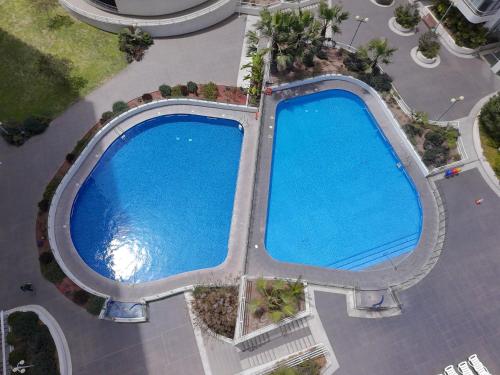 Бассейн в Rotterdam Iquique Departamento para 2 con Parking y Piscina или поблизости
