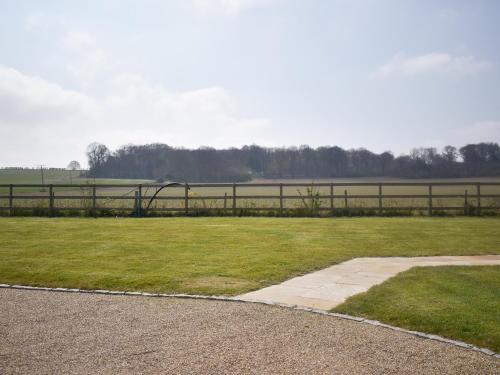a park with a fence and a grass field at Puxton Lodge in Fordwich