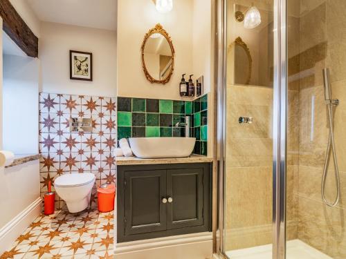 a bathroom with a sink and a shower at Buryemwick in Timble