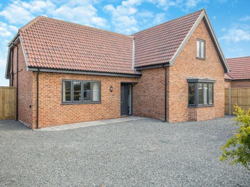 an image of a brick house with a driveway at Cowslip Cottage - Uk47072 in Maltby le Marsh