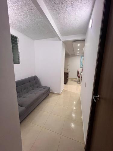 a living room with a couch and a hallway at Silvia Maria Lodging House in Valledupar