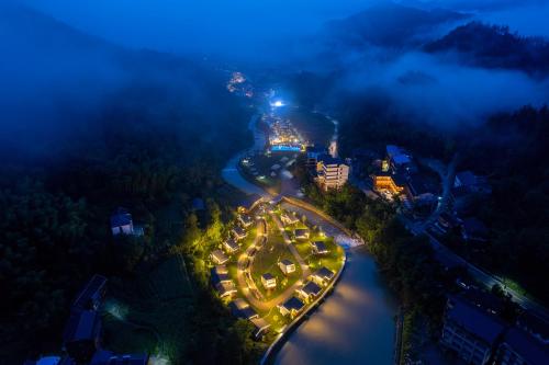 an aerial view of a river at night at Glamping Resort-At National Forest Park with Free Shuttle in Zhangjiajie