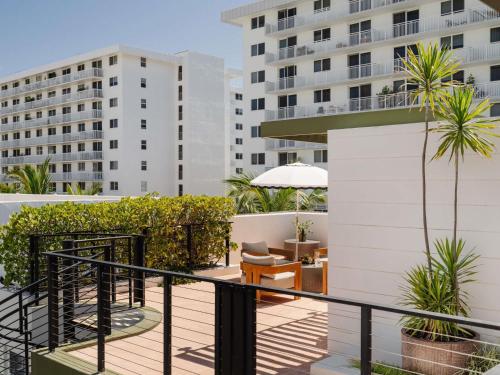 a balcony of a hotel with buildings in the background at Balfour Miami Beach, a Morgans Originals hotel in Miami Beach
