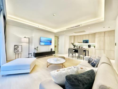 a living room with a couch and a table at Circle Sukhumvit 11 Bangkok in Bangkok