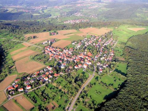 an aerial view of a village in a field at Pension Griebel in Buoch