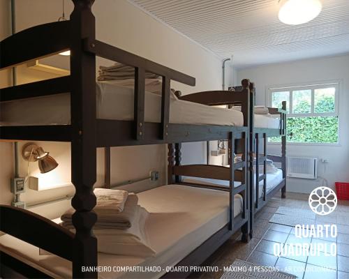 Ένα ή περισσότερα κρεβάτια σε δωμάτιο στο Primeiro Hostel