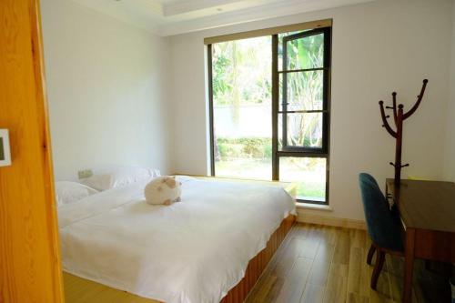 Ένα ή περισσότερα κρεβάτια σε δωμάτιο στο LanyiVilla