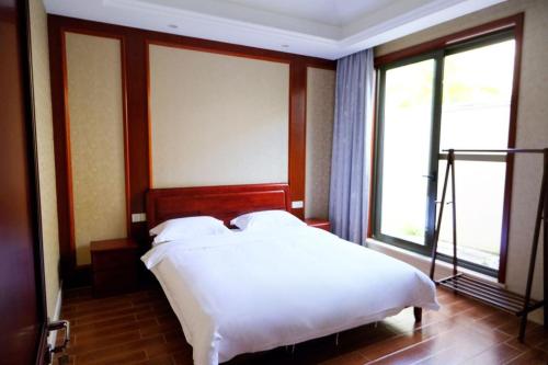 Ένα ή περισσότερα κρεβάτια σε δωμάτιο στο LanyiVilla