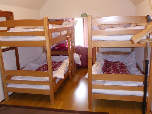 a group of bunk beds in a room at Sun Terrace Hakone in Hakone