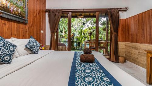 Postel nebo postele na pokoji v ubytování Uma Loris Ubud