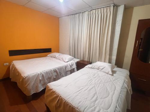 Ένα ή περισσότερα κρεβάτια σε δωμάτιο στο Hostal Orosheam