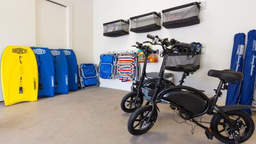 a bike is parked in a garage with blueunks at ❤PiH❤ A Sea-nic Escape Stunning Ocean View Mauna Kea Resort eBikes in Hapuna Beach
