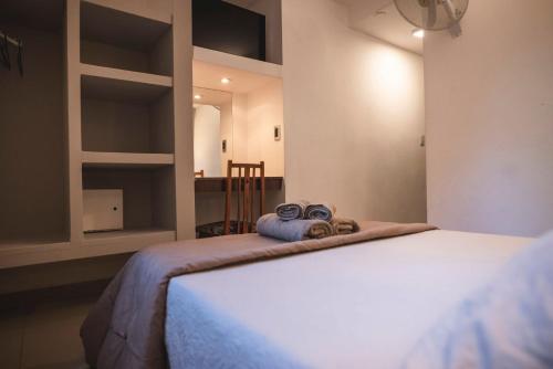 Кровать или кровати в номере Hotel Carlos Paz Centro - MONTECATINI