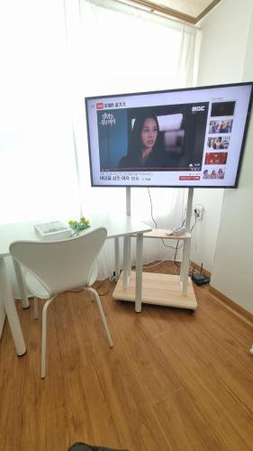 a computer monitor sitting on top of a table at Huestay Gumdan in Samgong